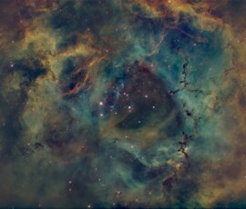 The Rosette Nebula (also known as Caldwell 49) is an H II (atomic Hydrogen that is ionized) region located near one end of a giant molecular cloud in the Monoceros region of the Milky Way Galaxy (near Orion). The cluster and nebula lie at a distance of about 5,000 light-years from Earth and measure roughly 130 light years in diameter. Photo by club member Adam Parsons. Rosette Nebula Adam Parsons